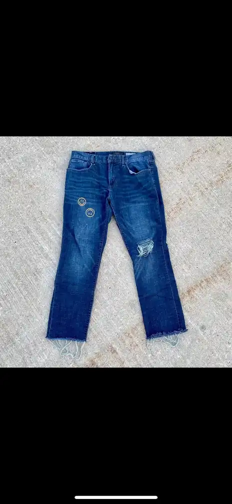 Custom embroidered smiley face jeans