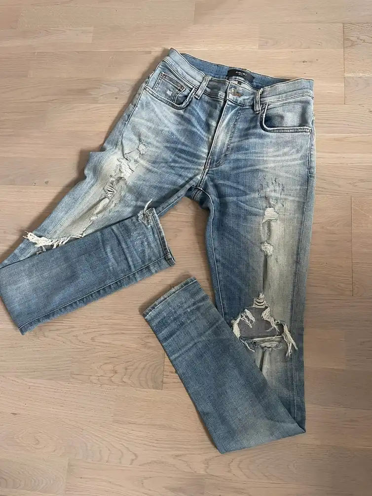 AMIRI men jeans real measurements shown by tape in photos
