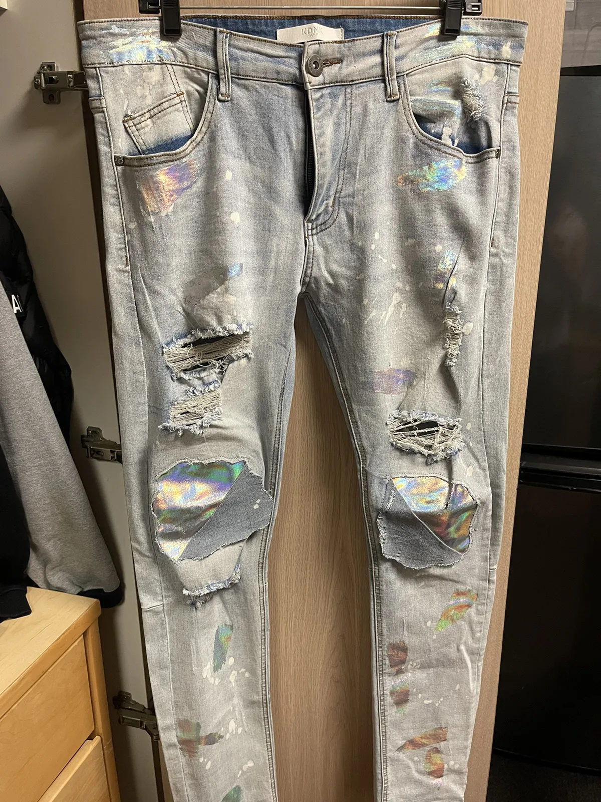 KDNK ripped holographic jeans
