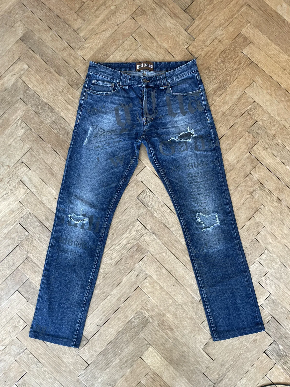 Galliano Gazette Newspaper Full Print Distressed Jeans