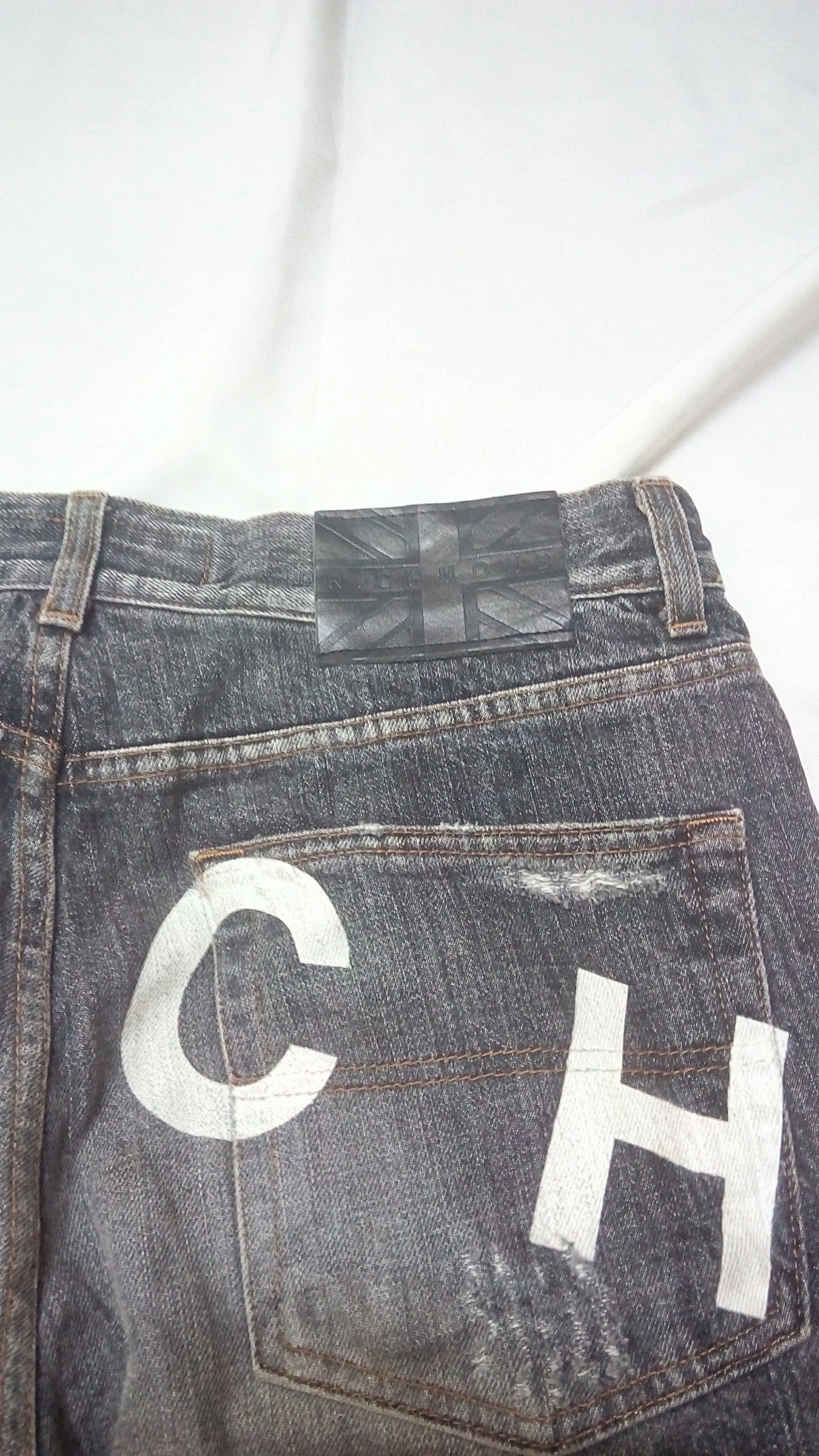 JOHN RICHMOND RICH SPELL OUT DISTRESSED JEANS