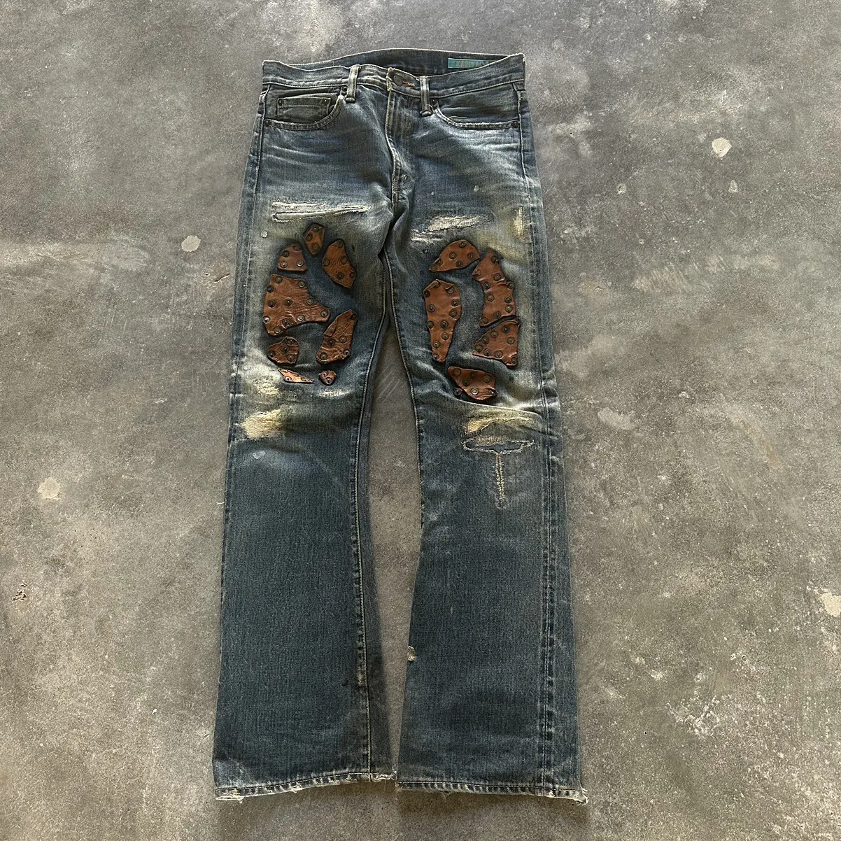 Leather patch studded denim