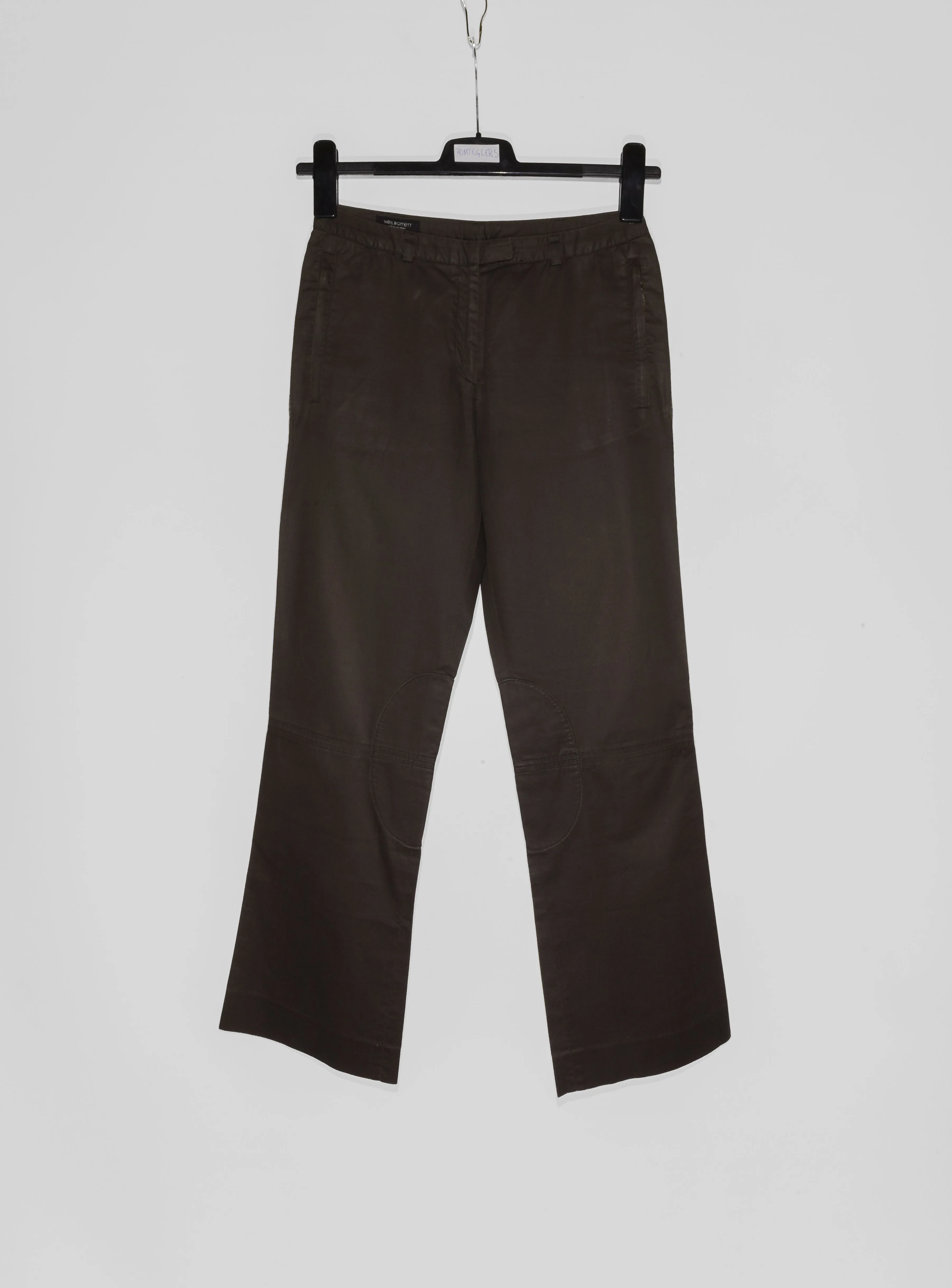 Neil Barret jeans with long sleeves, front button closure, welted zip up pockets, tailoring details and back strap in a dark brown colorway, size 40 - fits 29 - 30