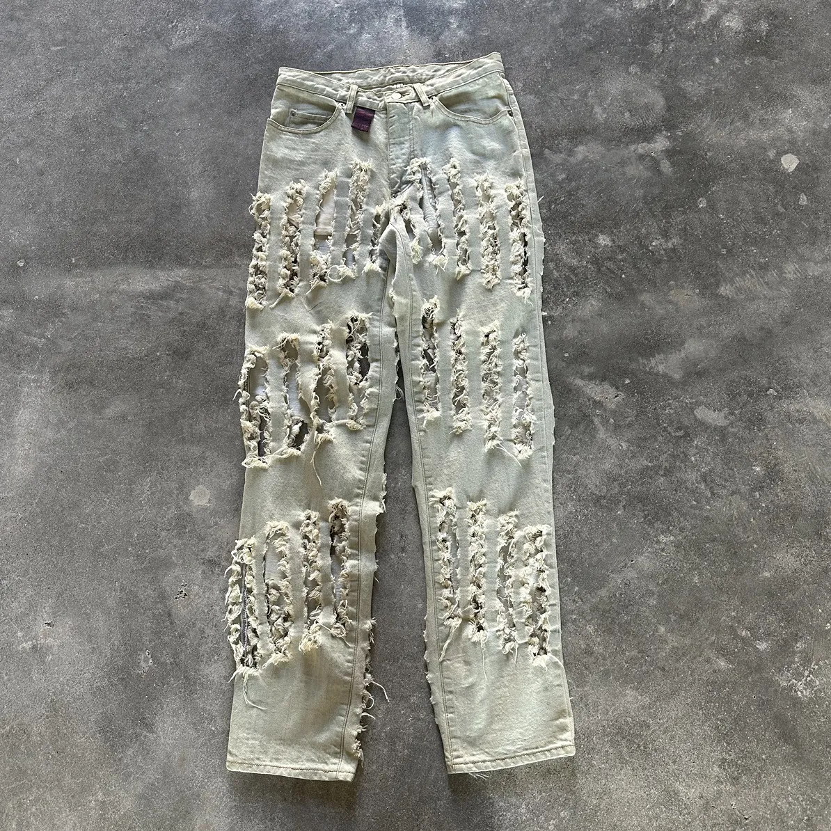 "Cut, Slash, and Pull" denim jeans