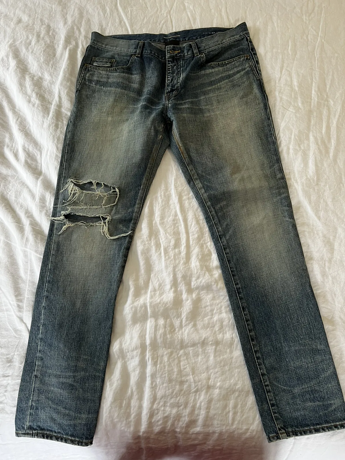 YSL distressed denim