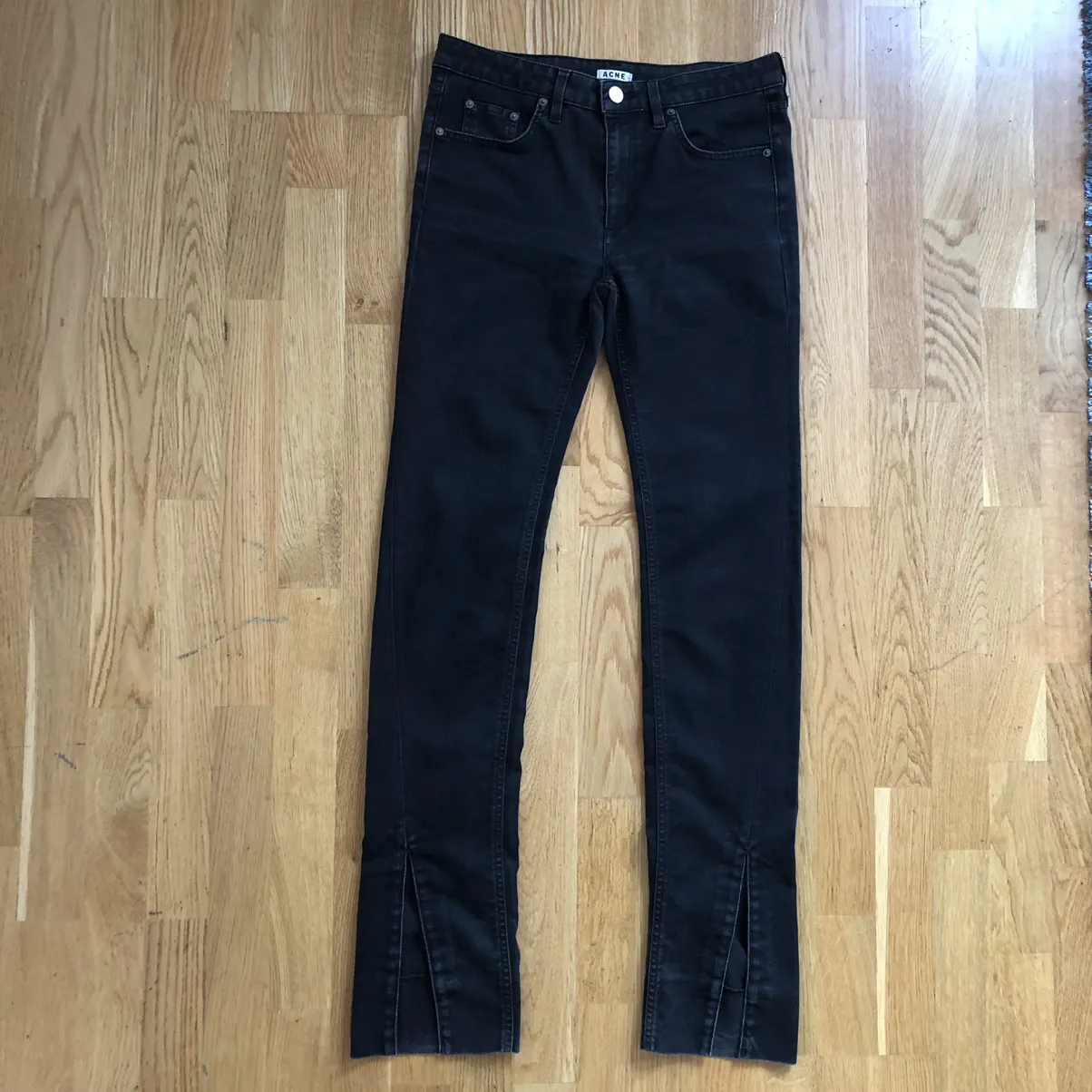 Black mid-waist skinny Acne jeans