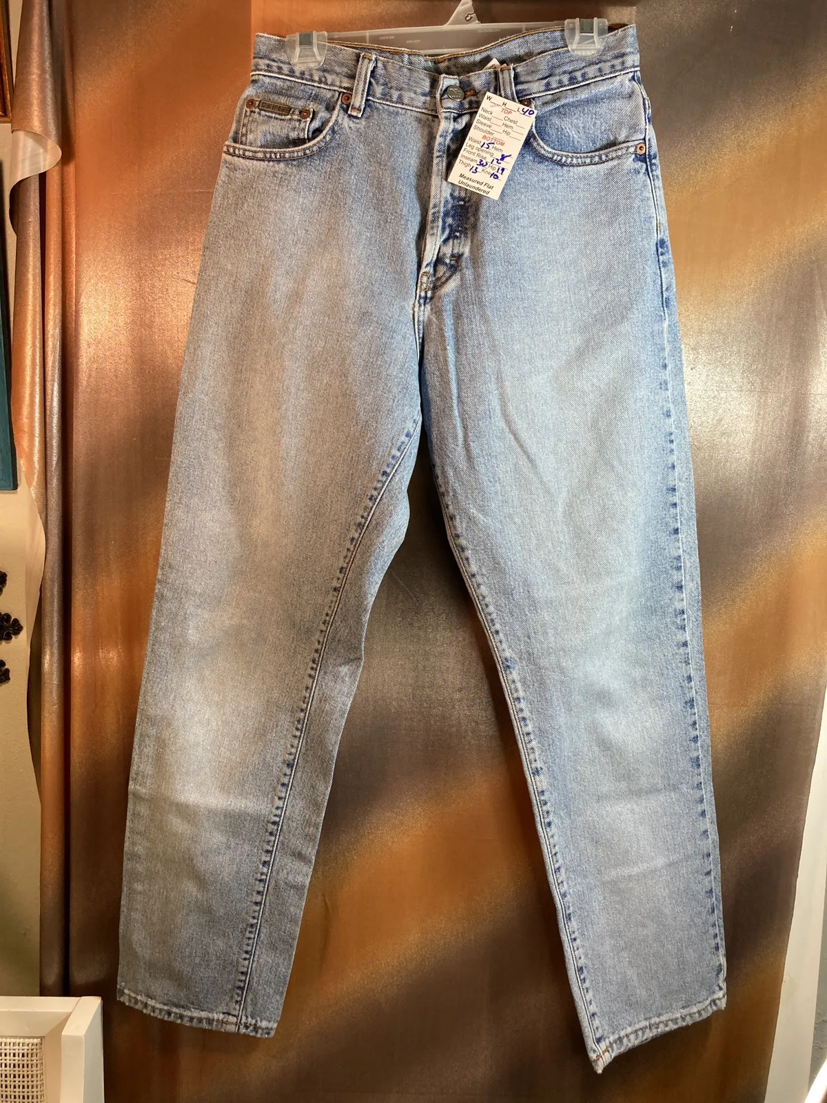 Calvin Klein distressed light blue jeans. 30” waist size 9