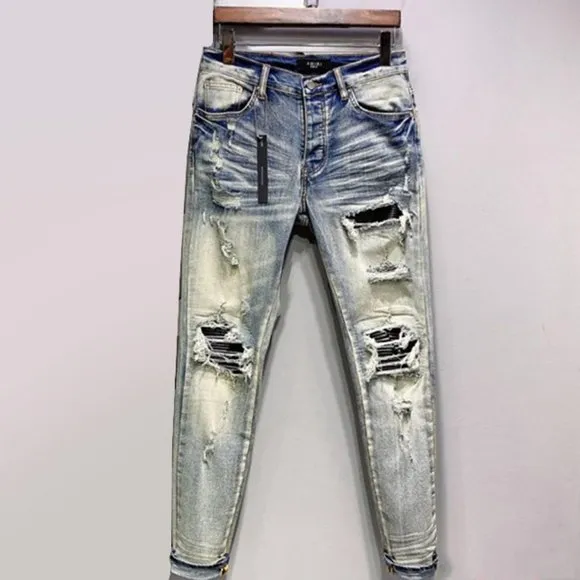 Amiri All Over Repair Aged Jeans