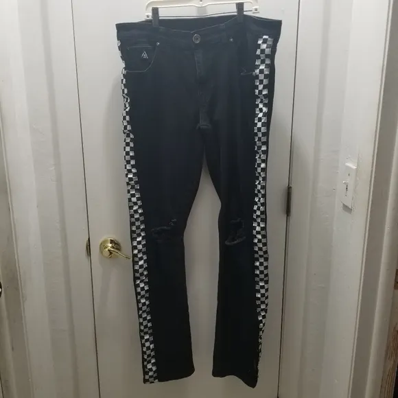 BLK DNM Collection. Black Distressed ripped Jean's Checkerboard on the s…