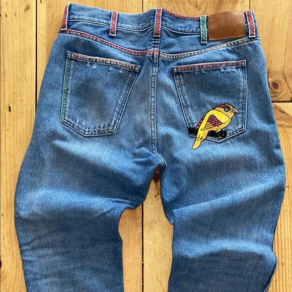 GUCCI: Slim Bird Embroidered Distressed Denim Jeans