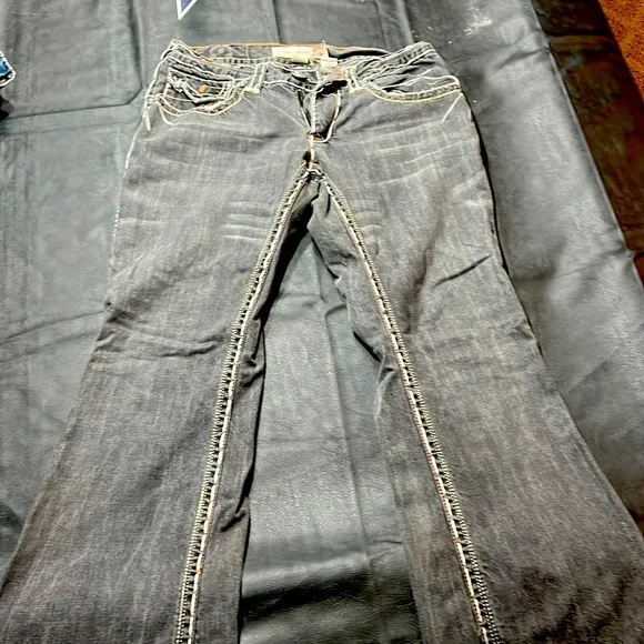 Black Laguna Beach jeans with thick white stitching