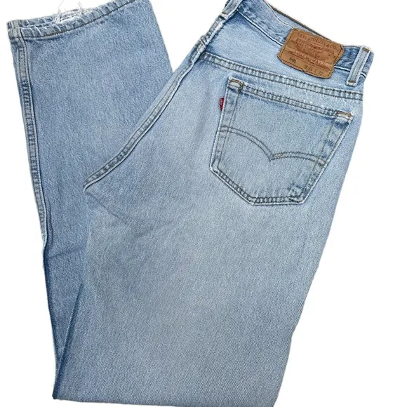 Vintage Levi’s 501 button fly light wash distressed cotton jeans size 36x32
