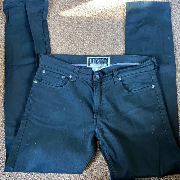 Levi’s skinny 511 black jeans with rivets for tall dude. Like new. Iconic look.