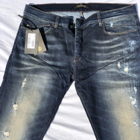 Roberto Cavalli blue jeans. NYT.
          
      NWT