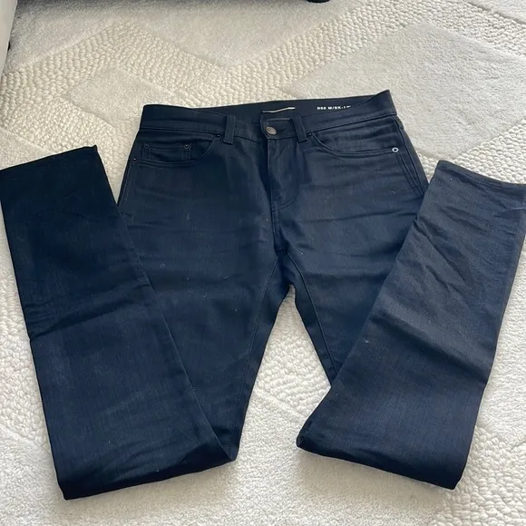 Authentic Saint Laurent coated black denim jean