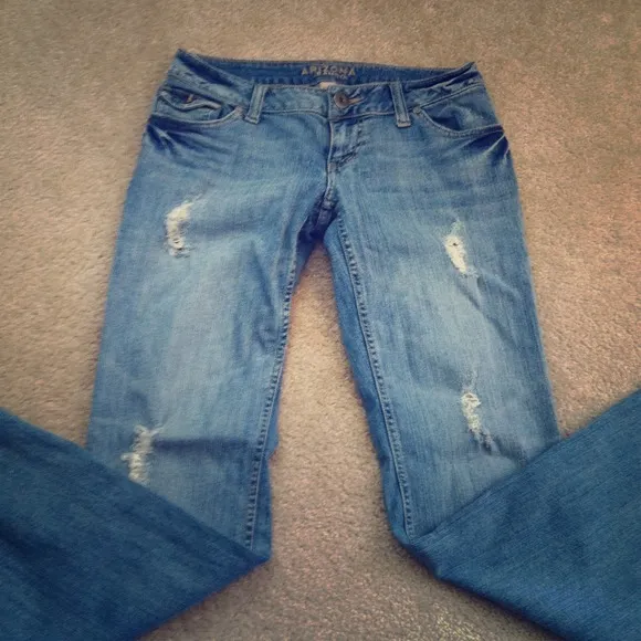 Distressed light denim flare jeans