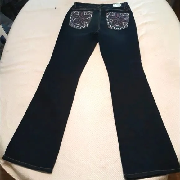 Vintage Y2k Baby Phat high-rise flared jeans with embellished pockets