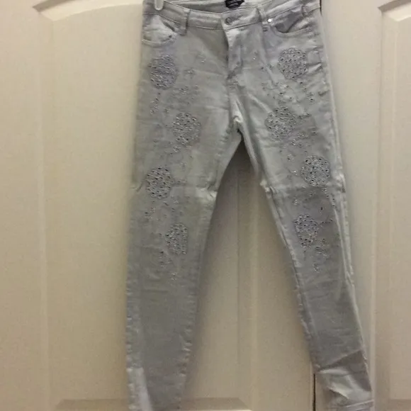 Bebe decorated jeans. Silver accents