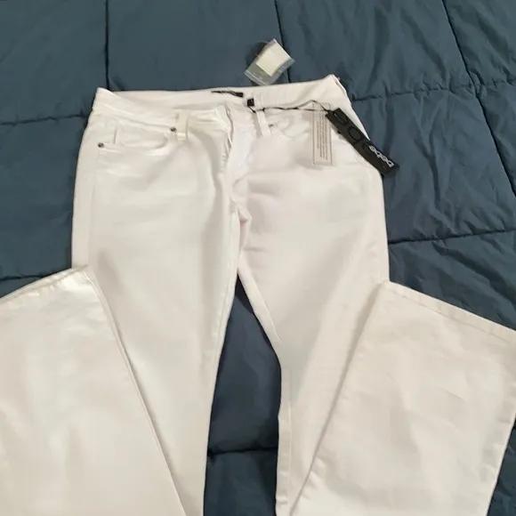 Bebe white boot cut jeans. NWT
          
      NWT
