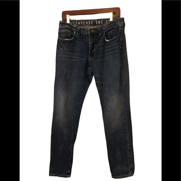Distressed slim fit tapered jean