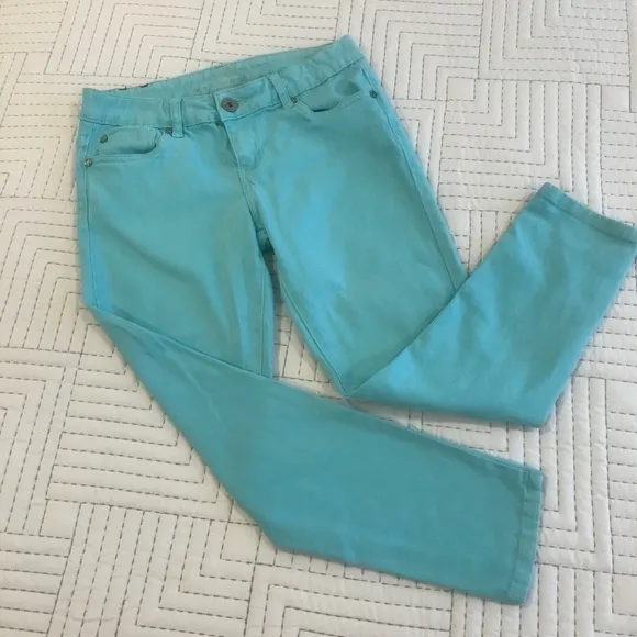 Soft turquoise crop jeans.